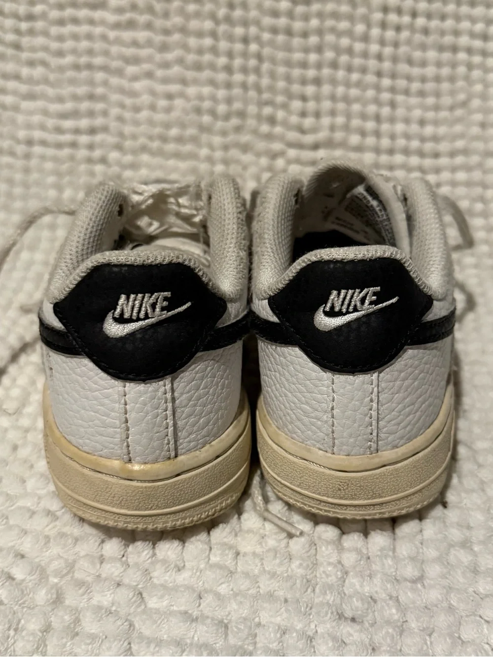 Nike Kids White Sneakers with Black Swoosh